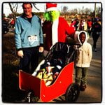 a guy, girl, baby, and Grinch