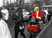 Grinch pushing sleigh in 5K race